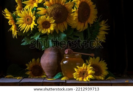 beautiful yellow Sunflower still life bouquet  in a clay jug ceramic rustic style oil honey Dark photo background wooden table Vintage. Retro. low key Autumn flowers