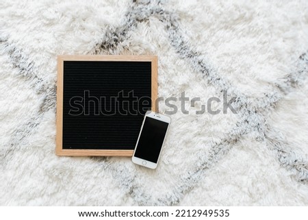 Black colored felt letter board mockups with phone