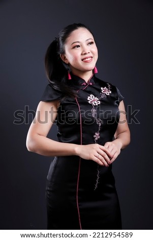 asian young woman wearing traditional chinese dress cheong sam