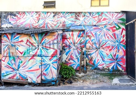 Colorful mural painting with graffiti in a favela at Dois Irmaos mountains in Rio de Janeiro, Brazil, South America