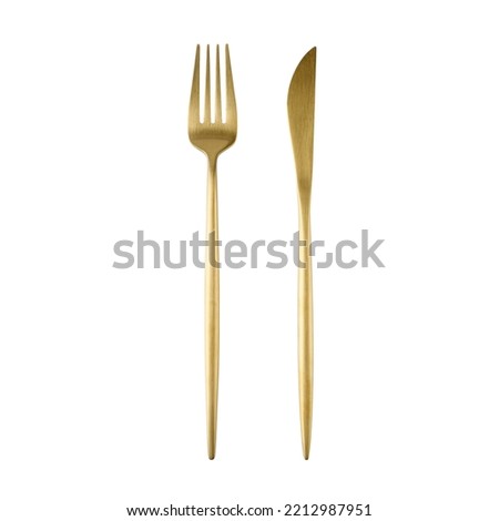 Matte golden color fork and knife isolated on white background. Cutlery set. Royalty-Free Stock Photo #2212987951