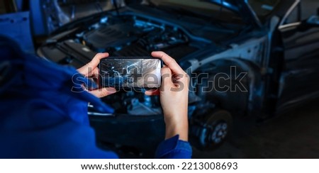Close up hand of woman holding smartphone and take photo of car accident. Wide banner.