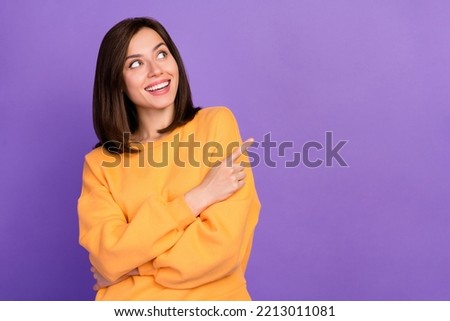 Close up photo of lovely satisfied lady trendy orange sweater arm direct empty space cool proposition isolated on purple color background