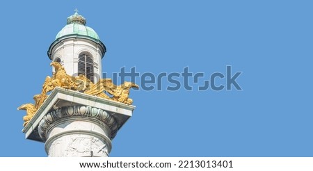 Banner with a praying tower of the Saint Karl Cathedral in Vienna, Austria, with solid blue sky and copy space background