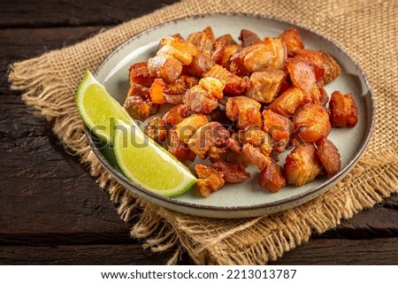 Pork rinds (torresmo), typical Brazilian food. Royalty-Free Stock Photo #2213013787