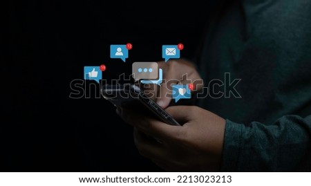 Social media and digital online on mobile phone. man using smartphone with social media to interactions icon on internet post. Data and marketing concept. Royalty-Free Stock Photo #2213023213