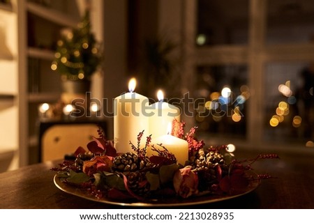 homemade Christmas centerpiece decor with Christmas tree on the background Royalty-Free Stock Photo #2213028935