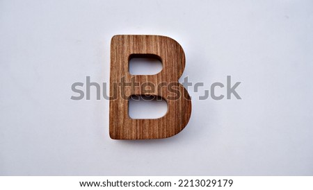 Wooden textured letter on a white background