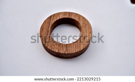 Wooden textured letter on a white background