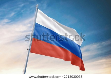 Russia flag and blue sky with clouds.