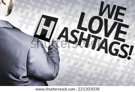 Business man with the text We Love Hashtags in a concept image
