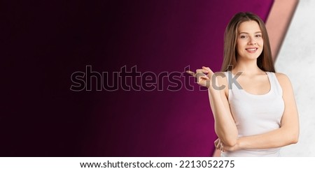 Happy young woman show something with hands