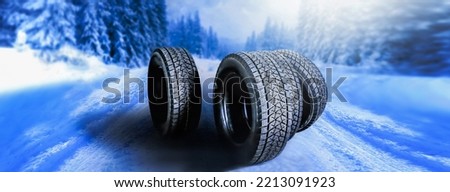 Winter tires on snowy road. Wide car tire banner for bussiness, panorama landscape or ice background. Royalty-Free Stock Photo #2213091923