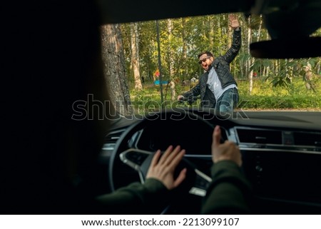 Woman driver knocks down man cyclist at speed. Concept accident with bicycle is distracted by phone. Royalty-Free Stock Photo #2213099107