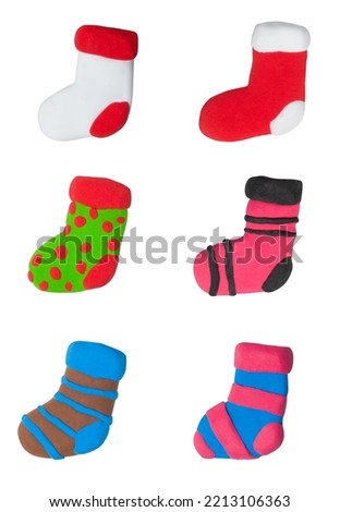 Set of Christmas sock made from plasticine on white isolated background