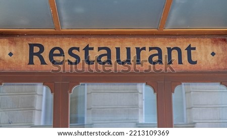 Restaurant Sign English at Retro Building Exterior