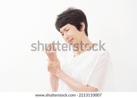 Asian middle aged woman in white background