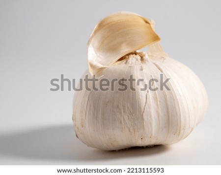 Garlic on a light background. Healthy food concept. Close-up.