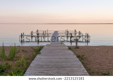 Dock at sunset on Otter Tail Lake in rural Minnesota
