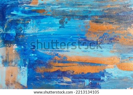 Color abstract acrylic painting background with blue and golden hand strokes