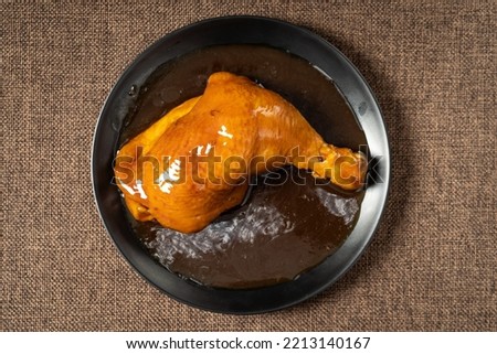 Braised Roasted Chicken Legs on Monochrome Background