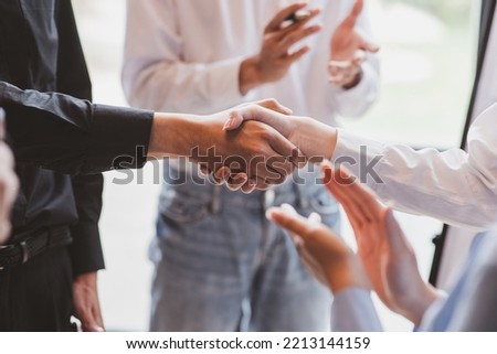 Businesswoman handshake and business people. Successful business handshake concept. Royalty-Free Stock Photo #2213144159