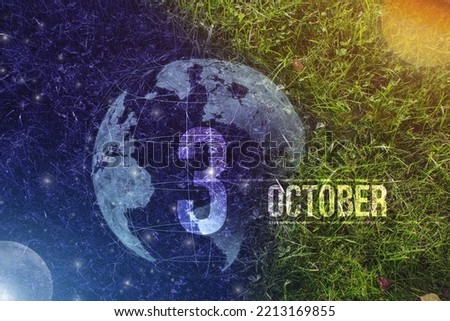 October 3rd. Day 3 of month, Calendar date. Day to night background concept. Scene with globe the green grass with sun, stars, moon and calendar date.   Autumn month, day of the year concept