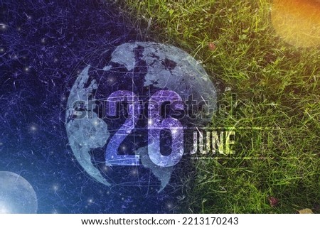 June 26th. Day 26 of month, Calendar date. Day to night background concept. Scene with globe the green grass with sun, stars, moon and calendar date.   Summer month, day of the year concept