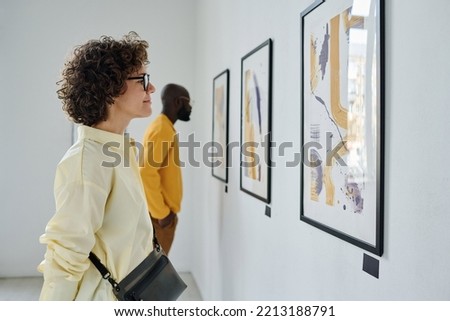 People enjoying art at gallery Royalty-Free Stock Photo #2213188791