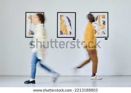 People visiting modern art gallery