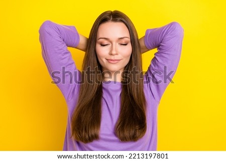 Photo of calm charming pretty woman wear purple pullover closed eyes hands behind head take nap chill isolated on bright yellow color background