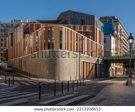 Flandres district. Modern wooden facade of building at sunset