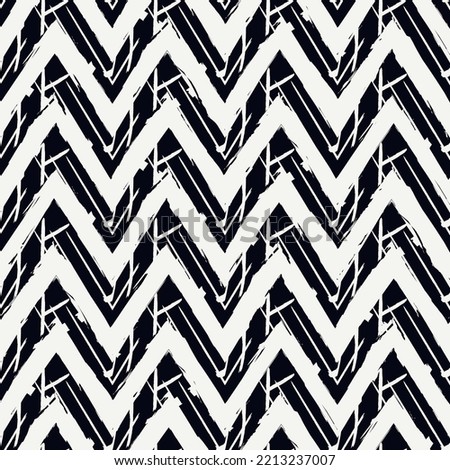 Ethnic seamless pattern. Freehand zigzag stripes print. Boho chic design background. Tribal style wallpaper. Brush wavy lines. Handdrawn geometric ornament. Chevron backdrop. Indigenous image