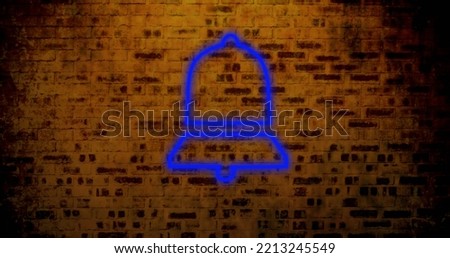 Composite of illuminated digital notification bell icon against abandoned brick wall, copy space. Social media, blue, information, reminder, symbol and technology concept.