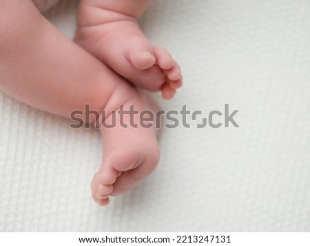 small legs of a newborn close-up, foot, foot, toes, heel of babies