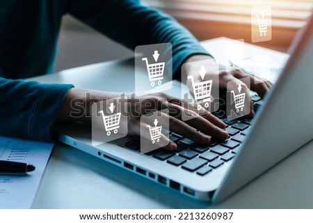 Digital Marketing. woman hand online shopping on laptop computer with virtual graphic icon diagram on desk, payment online, shopping online, business finance, internet network technology concept