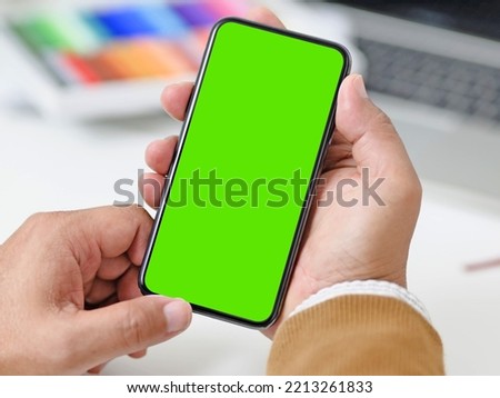 Person Using Smartphone in hands Green Screen Royalty-Free Stock Photo #2213261833