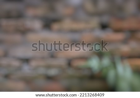 Blurred photo of Vintage wall for abstract background and texture. Batu bata wall. Stone background batu bata. Unfinished red brick wall.