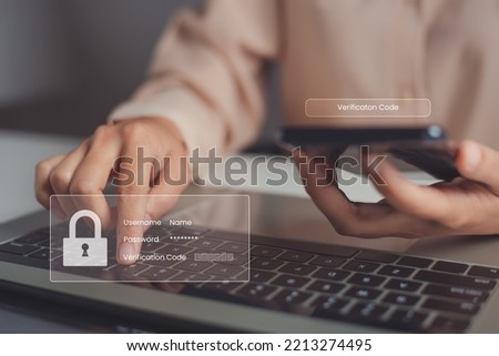 Female hand enters one-time password received on mobile phone for authentication process to login to web page, mobile OTP security authentication method, 2-step authentication web page. Royalty-Free Stock Photo #2213274495