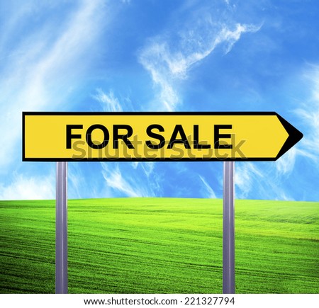 Conceptual arrow sign against beautiful landscape with text - FOR SALE