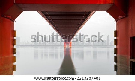 red steel bridge over the river