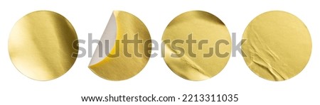 Blank golden round adhesive paper metallic sticker label set isolated on white background
