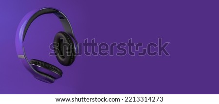 purple headphones, on a purple background, copy space Royalty-Free Stock Photo #2213314273