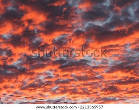Dramatic sunset sky with orange clouds