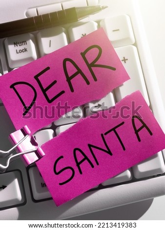 Text sign showing Dear Santa. Word Written on letter intended for Santa Claus written by kids during Christmas