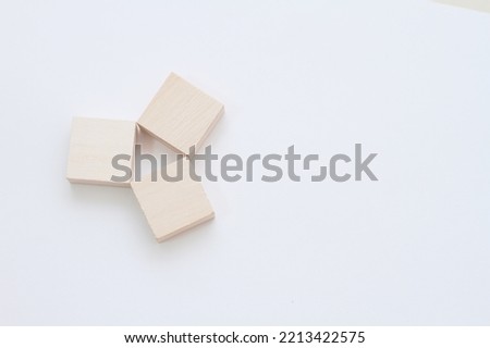 three wooden cubes on a white background