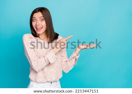 Close up photo of nice young lady point impressed promo space dressed stylish smart casual clothes isolated on aquamarine color background