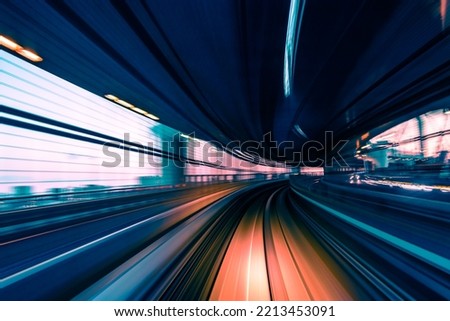 Long exposure motion blur from Yurikamome Monorail line in Tokyo, Japan. Abstract for Digital, Metaverse Technology, Futuristic Transportation, Computer Network, and Communication concept. Royalty-Free Stock Photo #2213453091