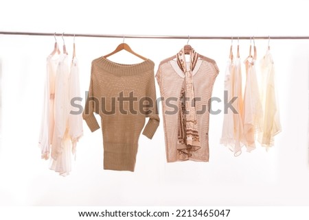 Set of different knitted ,sweater,shirt, dress,scarf  on hanger
