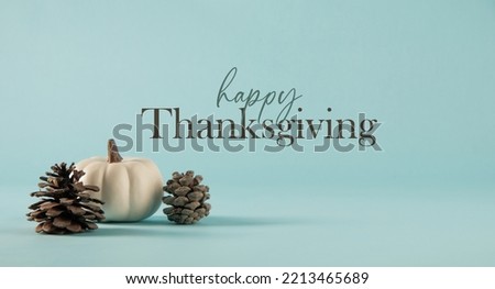 Minimalism style Thanksgiving greeting holiday banner with copy space on blue modern background. Royalty-Free Stock Photo #2213465689